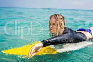 woman with a surfboard on a sunny day