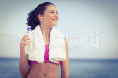 Pretty fit woman holding water bottle