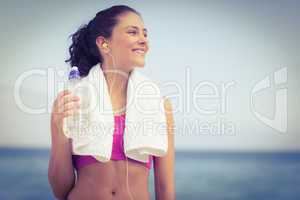 Pretty fit woman holding water bottle