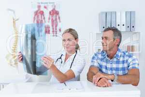 Doctor showing X rays to her patient