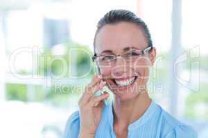 Smiling businesswoman having a phone call