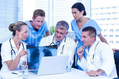 Medical team looking at x-ray together
