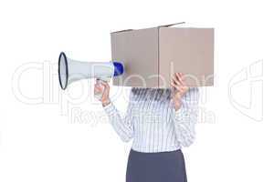Businesswoman with box over head and holding a megaphone