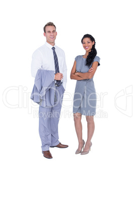 Happy business people looking at camera