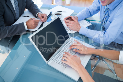 Business people in discussion in an office Business people in discussion in an office