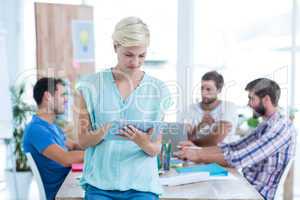 Businesswoman using tablet in the office