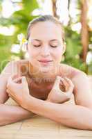 Peaceful blonde lying on massage table