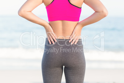 Wear view of fit woman looking at the sea