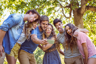 Happy friends taking a selfie