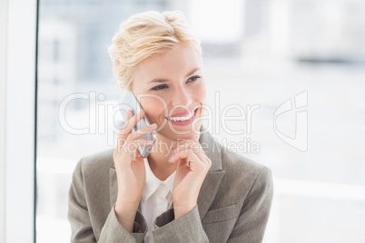 Smiling businesswoman on the phone