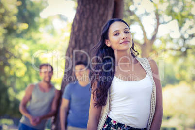 Pretty hipster smiling in the park