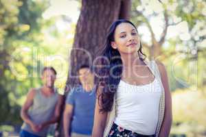 Pretty hipster smiling in the park