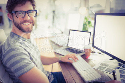 Casual businessman using computer in office