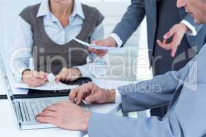 Business people using laptop