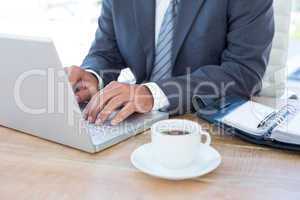 Businessman working with his laptop