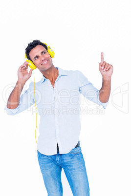 Handsome man listening music with headphone