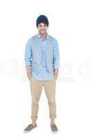 Handsome hipster with hands in pocket looking at camera