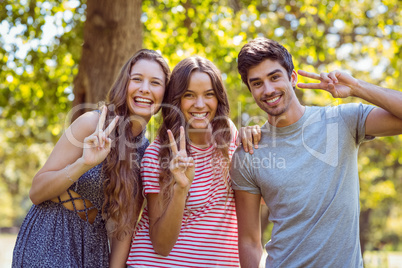 Happy friends smiling at camera