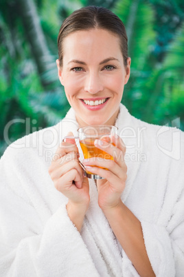 Close up of a beautiful young woman drinking tea