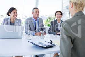 Interview panel listening to applicant