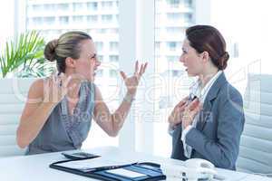 Businesswoman yelling at colleague