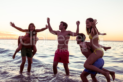 Happy friends having fun in the water