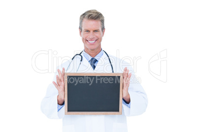 Portrait of a doctor holding a board