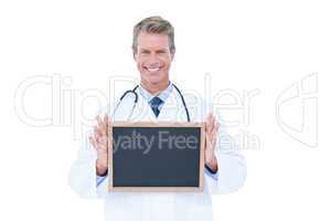 Portrait of a doctor holding a board