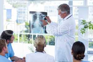 Team of doctors looking at xray