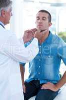 Doctor examining his patients ganglion