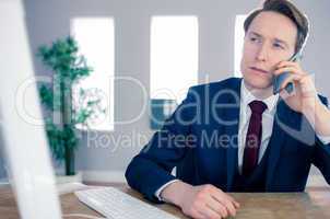 Serious businessman having a phone call