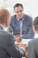 Businessman explaining contract to business partners