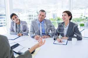 Interview panel listening to applicant