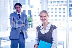 Business people smiling at the camera