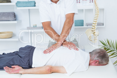 Physiotherapist doing back massage