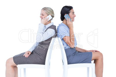 Two businesswomen having phone call