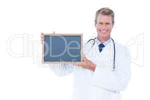 Portrait of a doctor holding a board