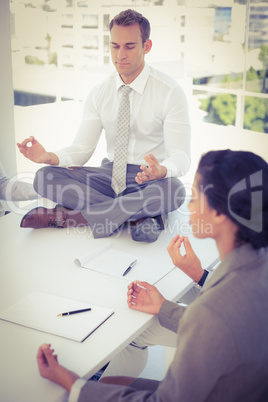 Business team relaxing eyes closed