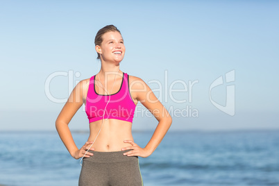 Beautiful fit woman listening music