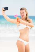 Happy pretty woman taking selfie