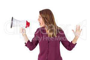 Pretty woman shouting with megaphone