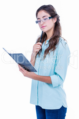 Pretty geeky hipster checking her notebook