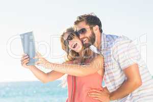 Happy couple taking selfie