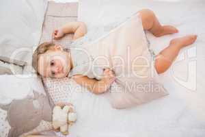 Portrait of a child in his bed with pillow