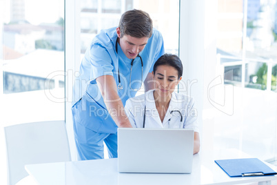 Team of doctors working on laptop Team of doctors working on laptop