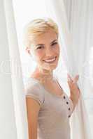 A portrait smiling blonde woman