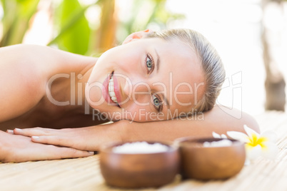 Beautiful woman receiving massage at spa center