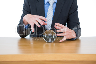 businessman holding a crystal ball