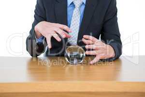 businessman holding a crystal ball
