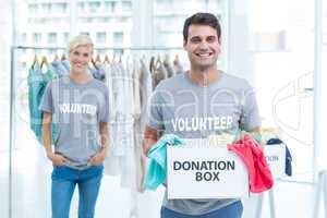 Volunteer man holding a donation box